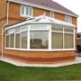 Conservatories available in white and a choice of wood grain finishes or a combination of white and wood grain, with the option of sculptured or bevelled sashes and glazing beads.